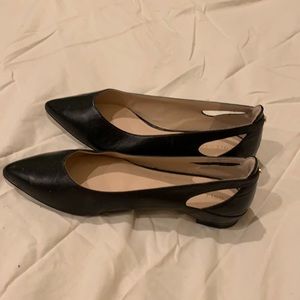 Black leather pointed toe flats